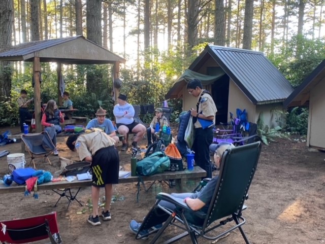 Scouts in their campsite being social.